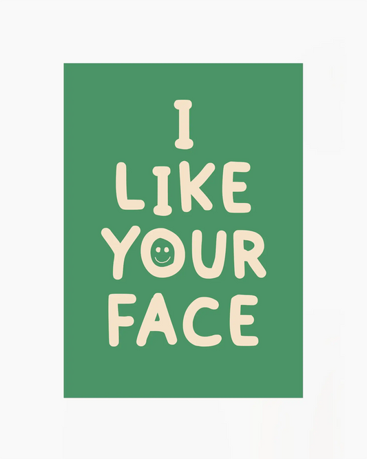 Green nursery poster with the text 'I like your face' written in beige.