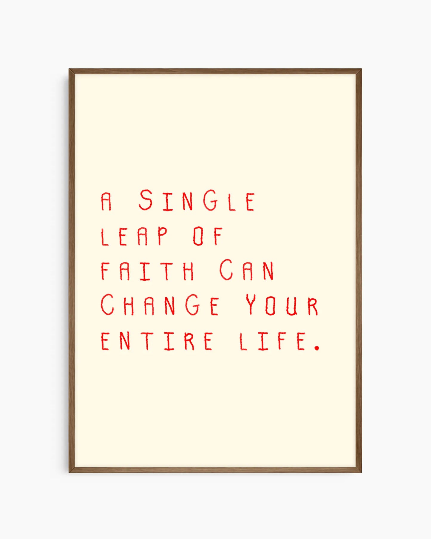 Nursery poster with the text 'A single leap of faith can change your entire life.' framed in a dark oak frame