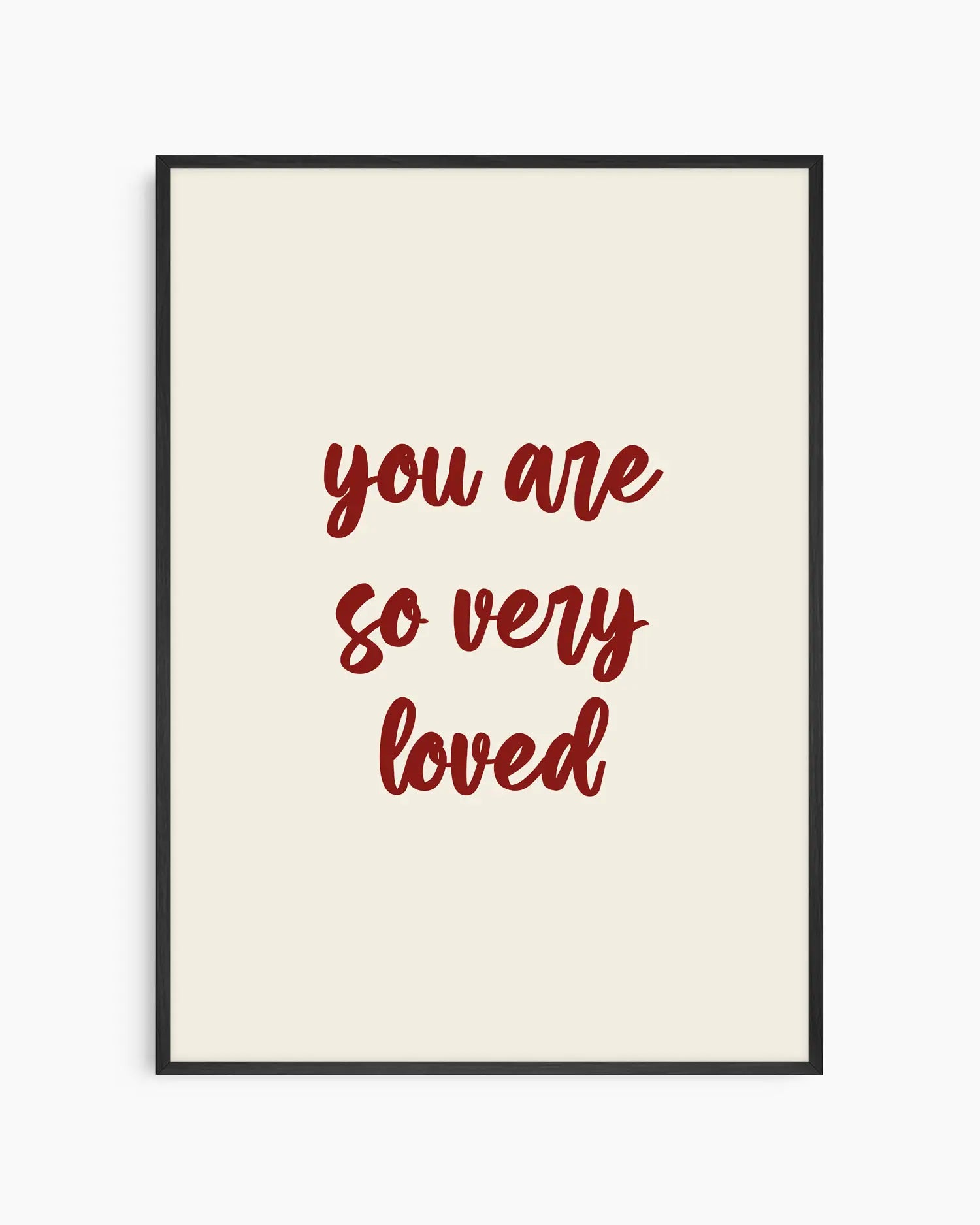 Nursery poster with red 'you are so very loved' text on a beige background. Black frame.