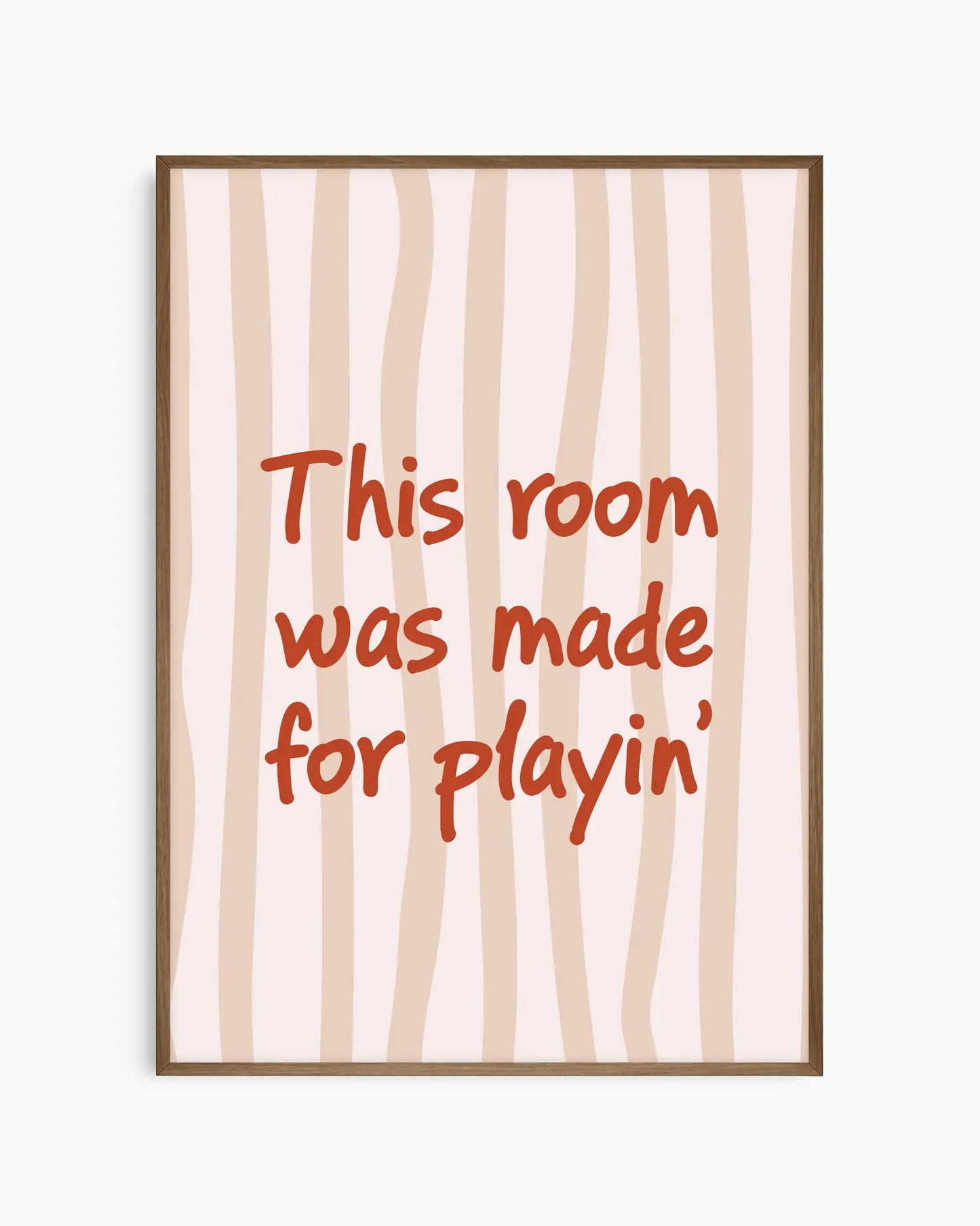 Nursery poster with text 'This room was made for playin'' on a beige striped background, framed in a dark oak wooden frame.