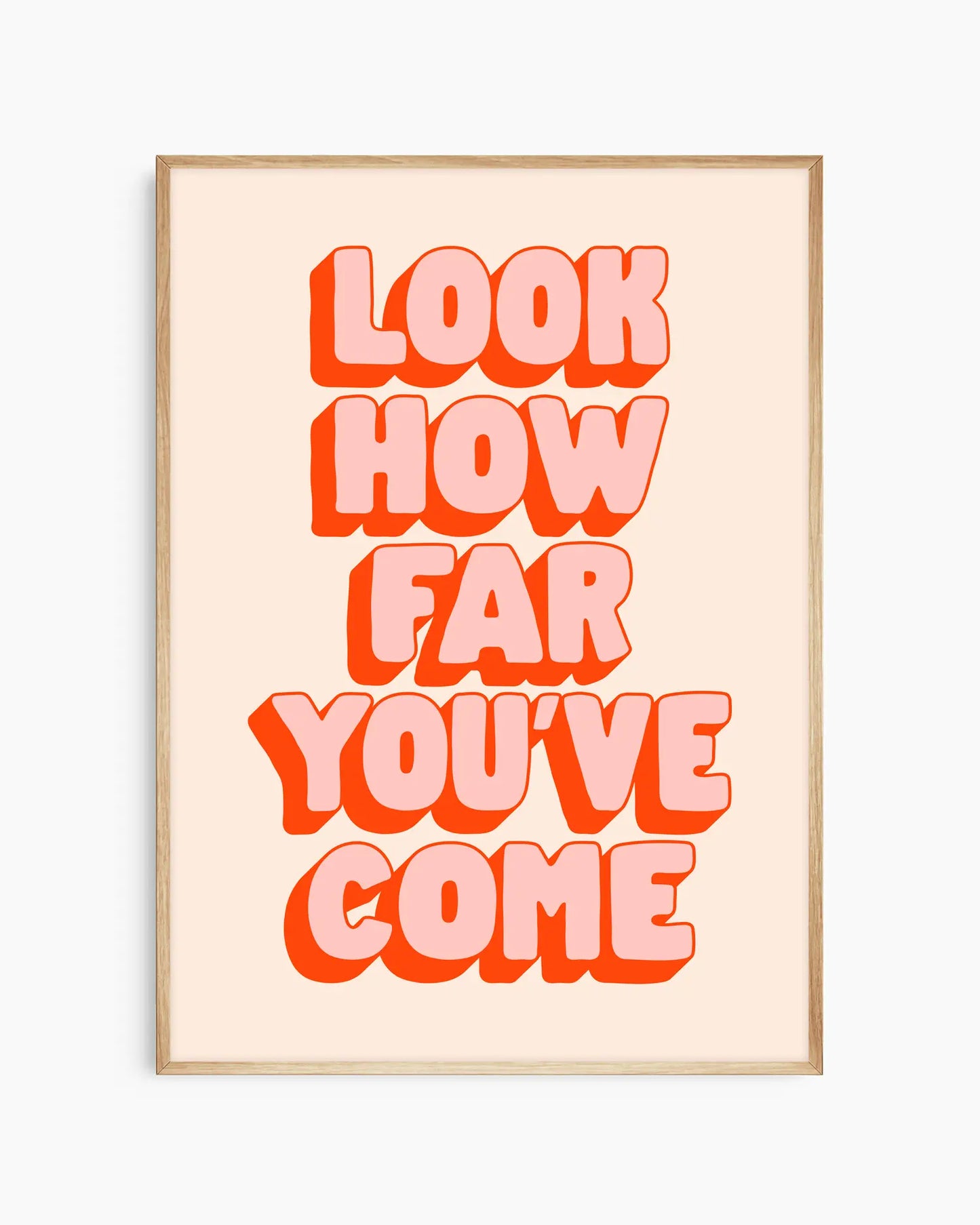 Framed poster with motivational quote 'Look how far you've come' in bold red letters on a light background