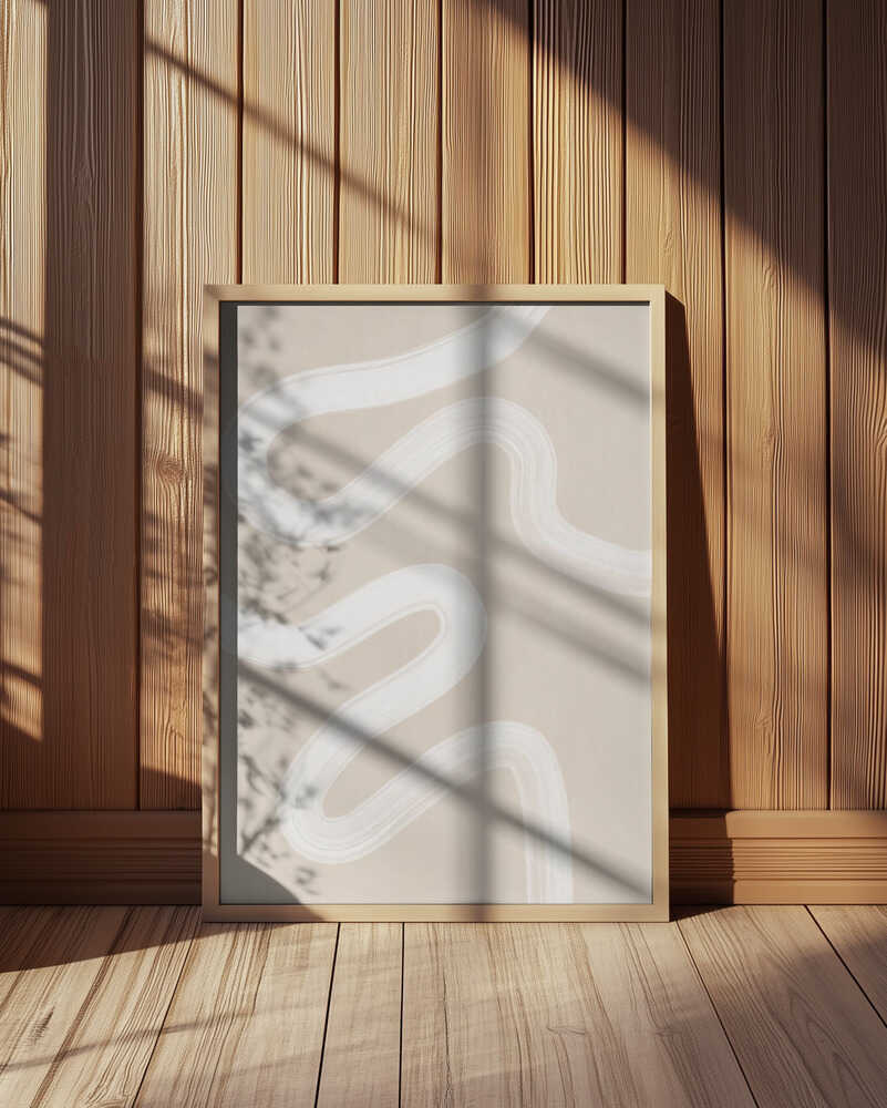 Minimalist abstract art print featuring soft white curved lines on a beige background. Displayed in a light wooden frame leaning against a wooden wall, with warm sunlight and shadows. Calm and elegant wall art perfect for modern Scandinavian interiors.