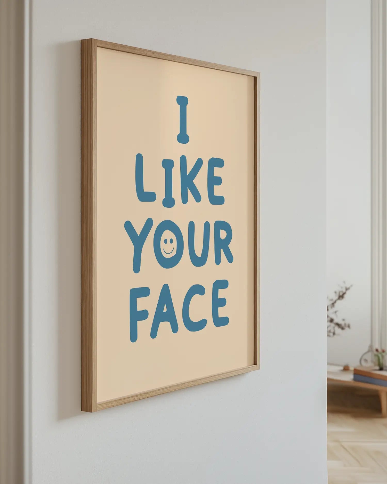 Artwork with 'I LIKE YOUR FACE' text on a wall.