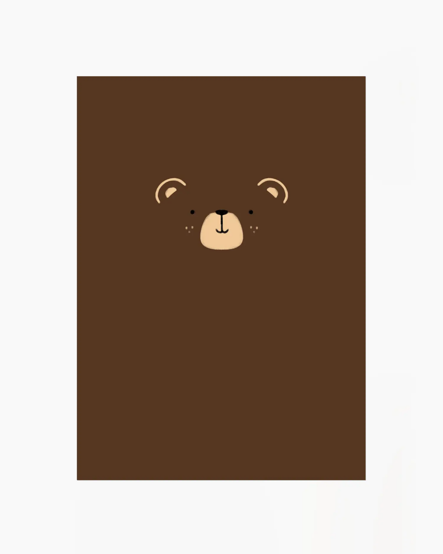 Brown notebook with a bear face design on a white background