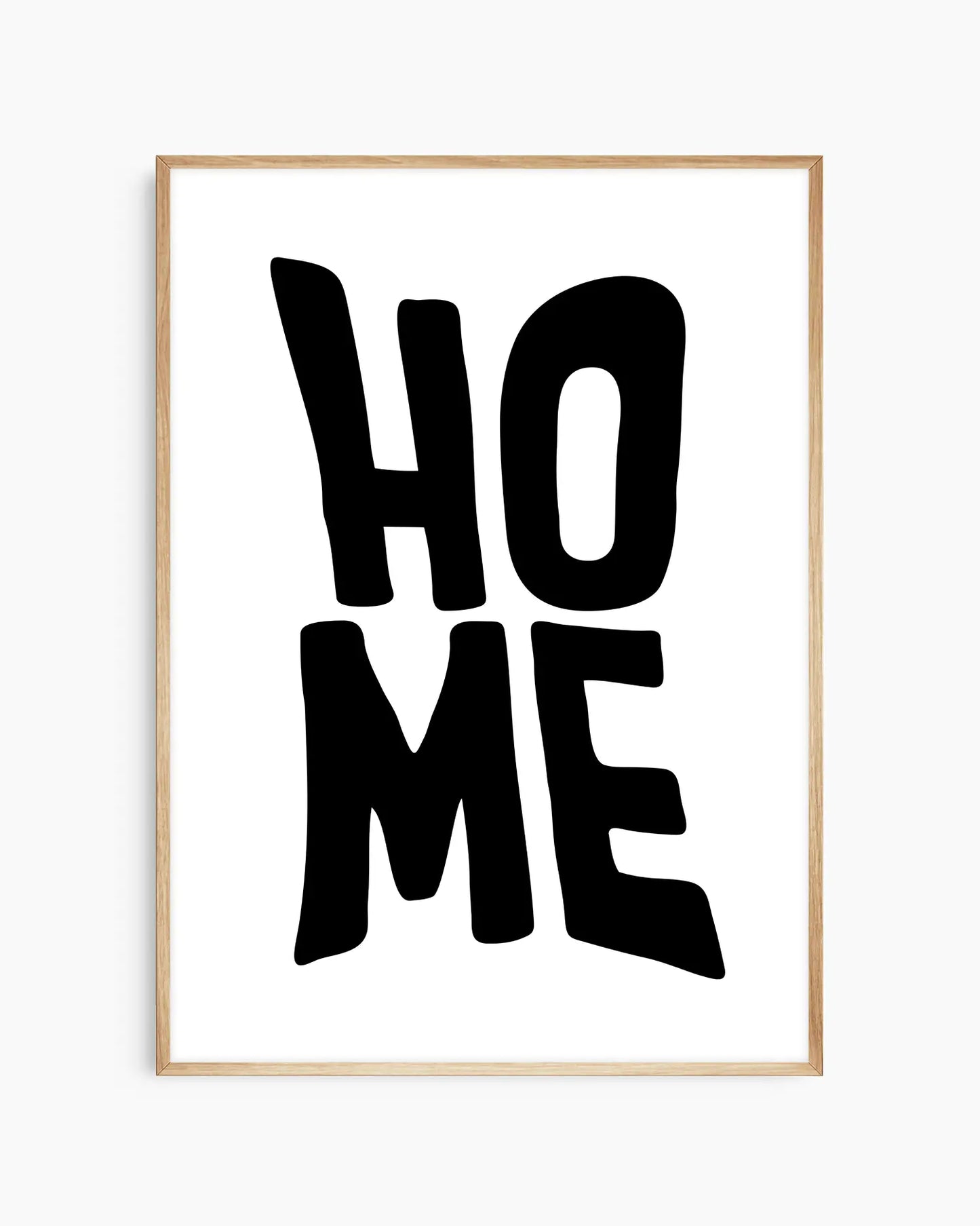 Framed artwork with 'HOME' text on a white background in an oak wooden frame.
