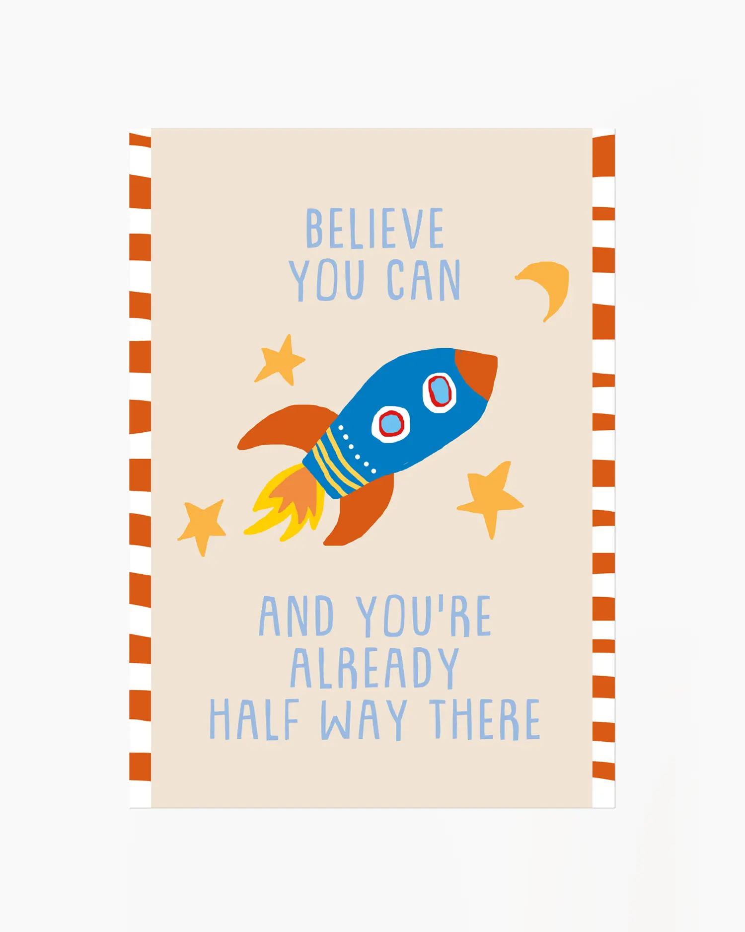 Notebook with a rocket illustration and motivational quote on a beige background