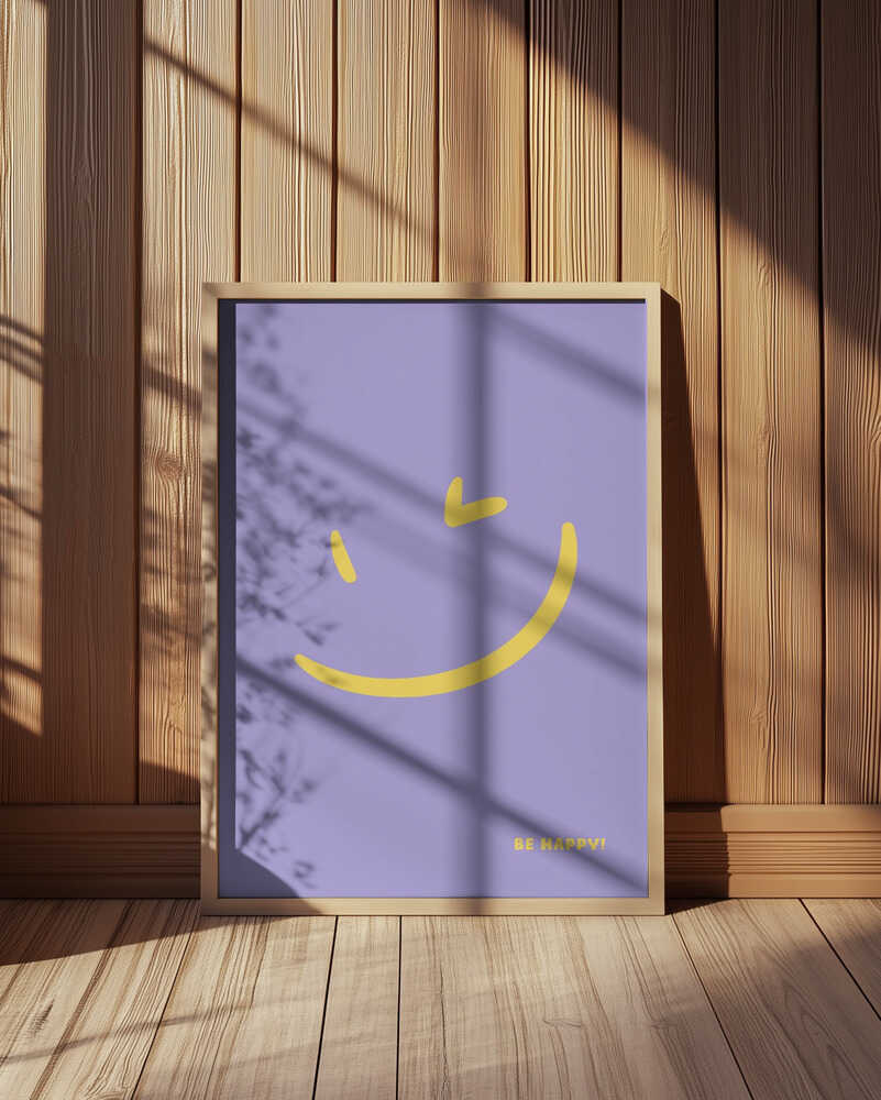Framed poster with a yellow smiley on a purple background and the text 'Be happy!' written on it. Leaning against a wooden wall.