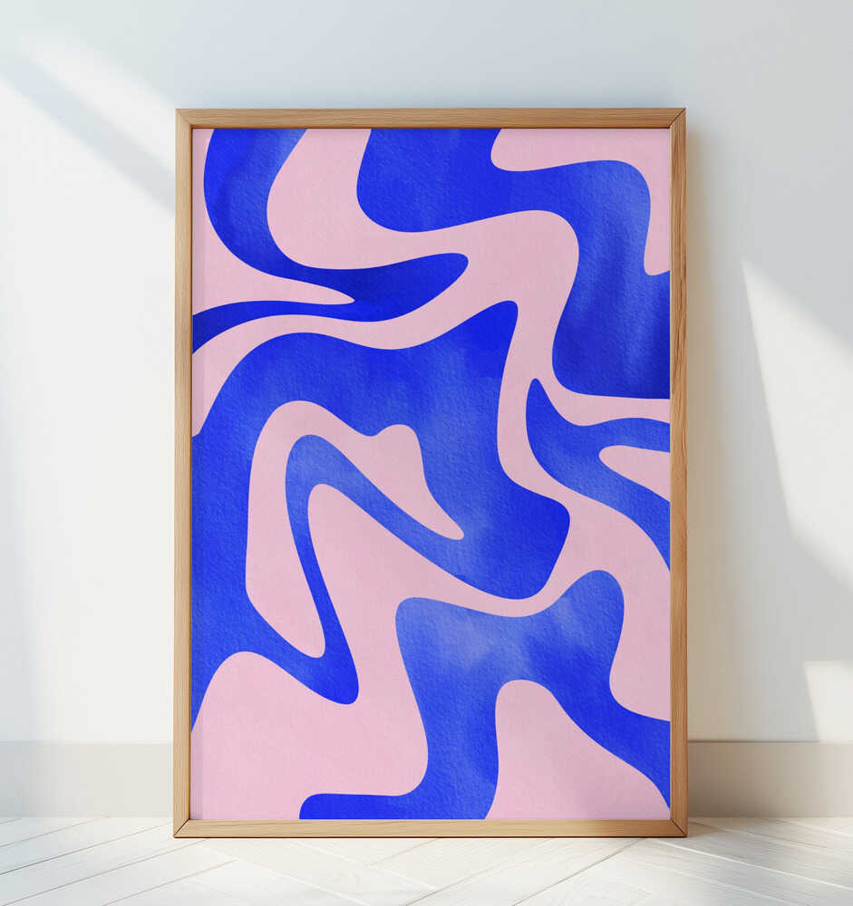 Contemporary abstract poster with flowing blue and pink shapes, framed in light wood and leaning against a white wall. Perfect statement wall art for living rooms, offices, or modern minimalist decor.