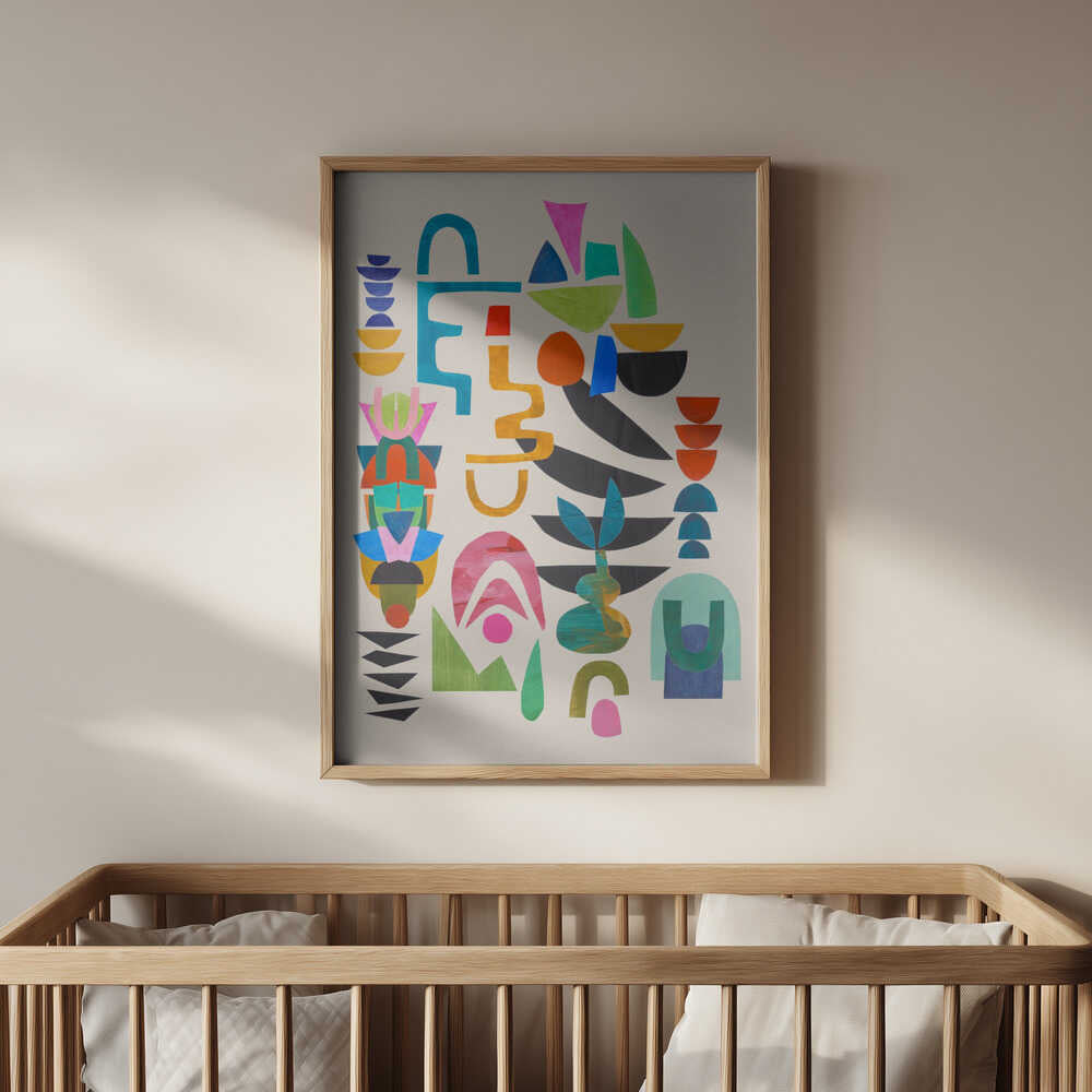 Vibrant abstract art print with colorful geometric shapes in a light wooden frame, hanging above a baby’s crib. Perfect nursery wall art that brings joy, color, and a modern artistic touch to any baby room.